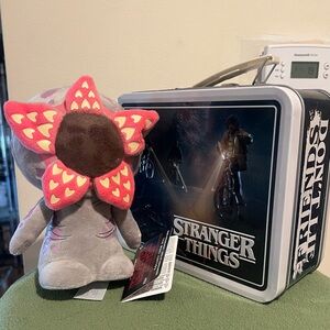 Loungefly Stranger Things metal lunchbox and Funko plush demogorgon.